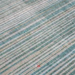 نمای زوم جلو قالیچه ماشینی دورو کد 1.00114 زمینه آبی مسی